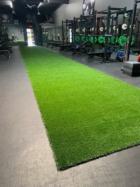 Man Golfing on Turf